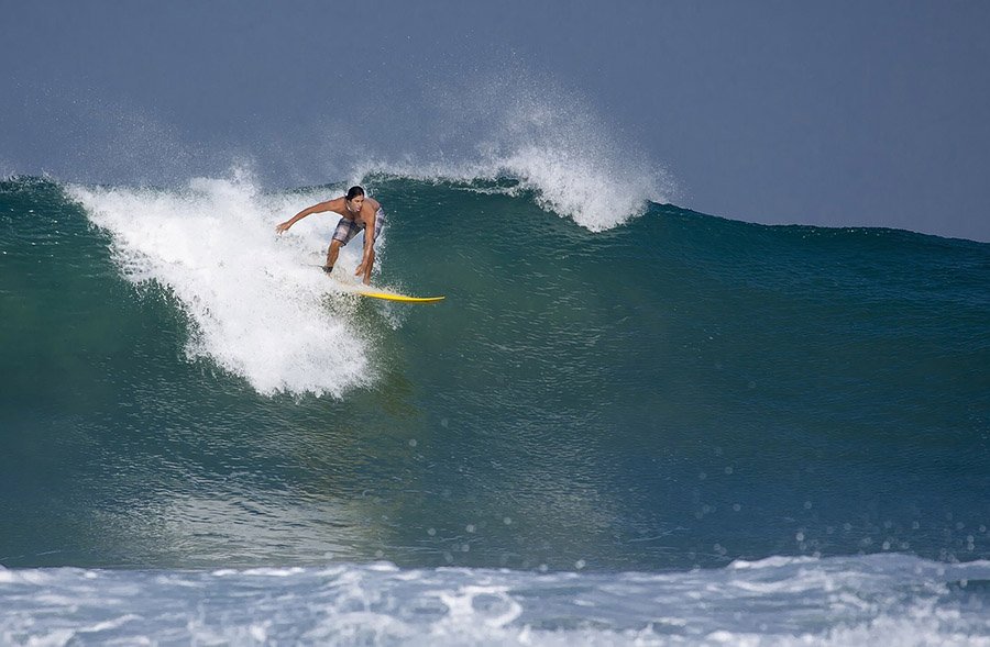 Surfer on a large wave